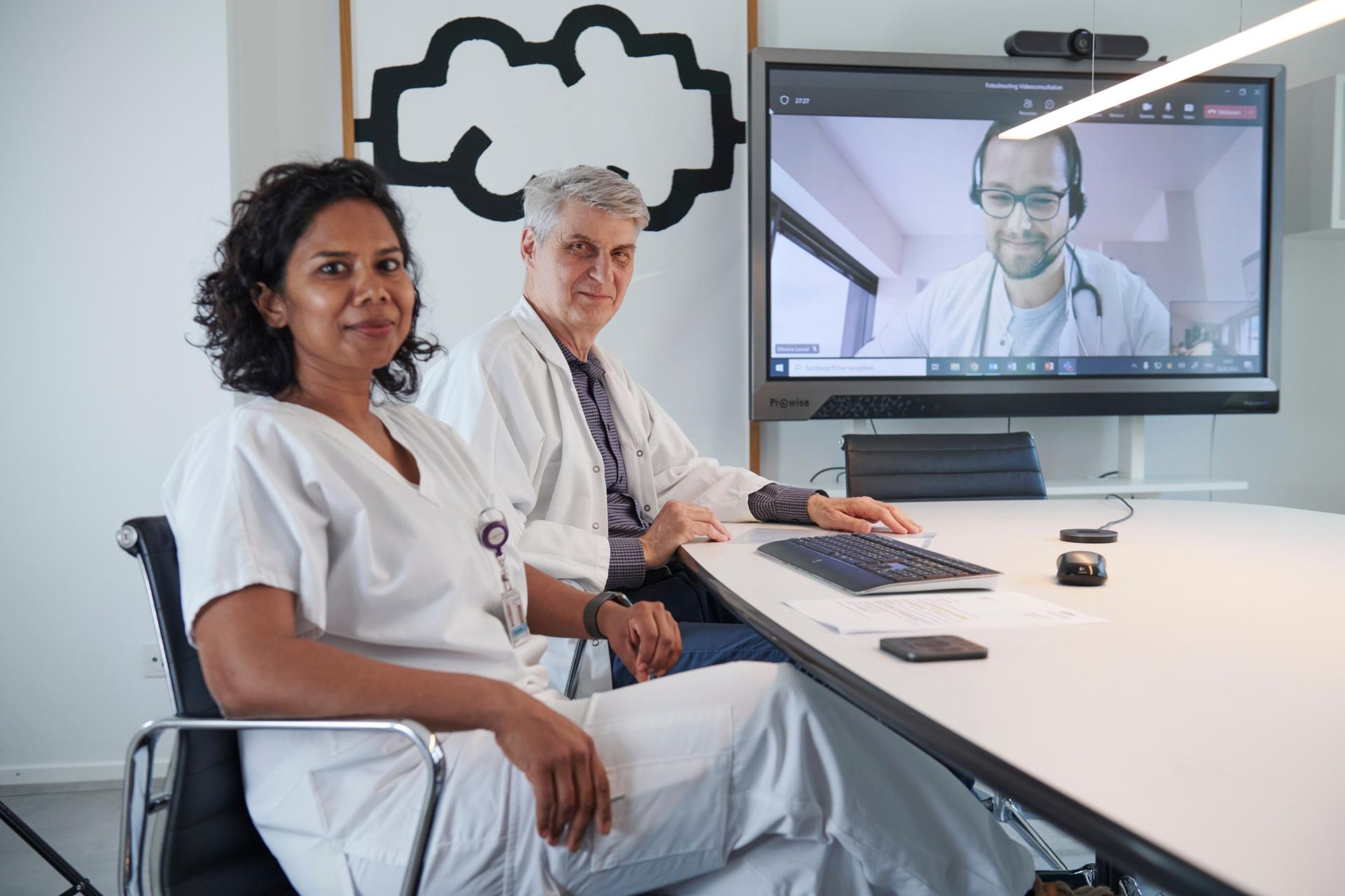 Doctors at Basel University Hospital consult a patient telemedically via video conference