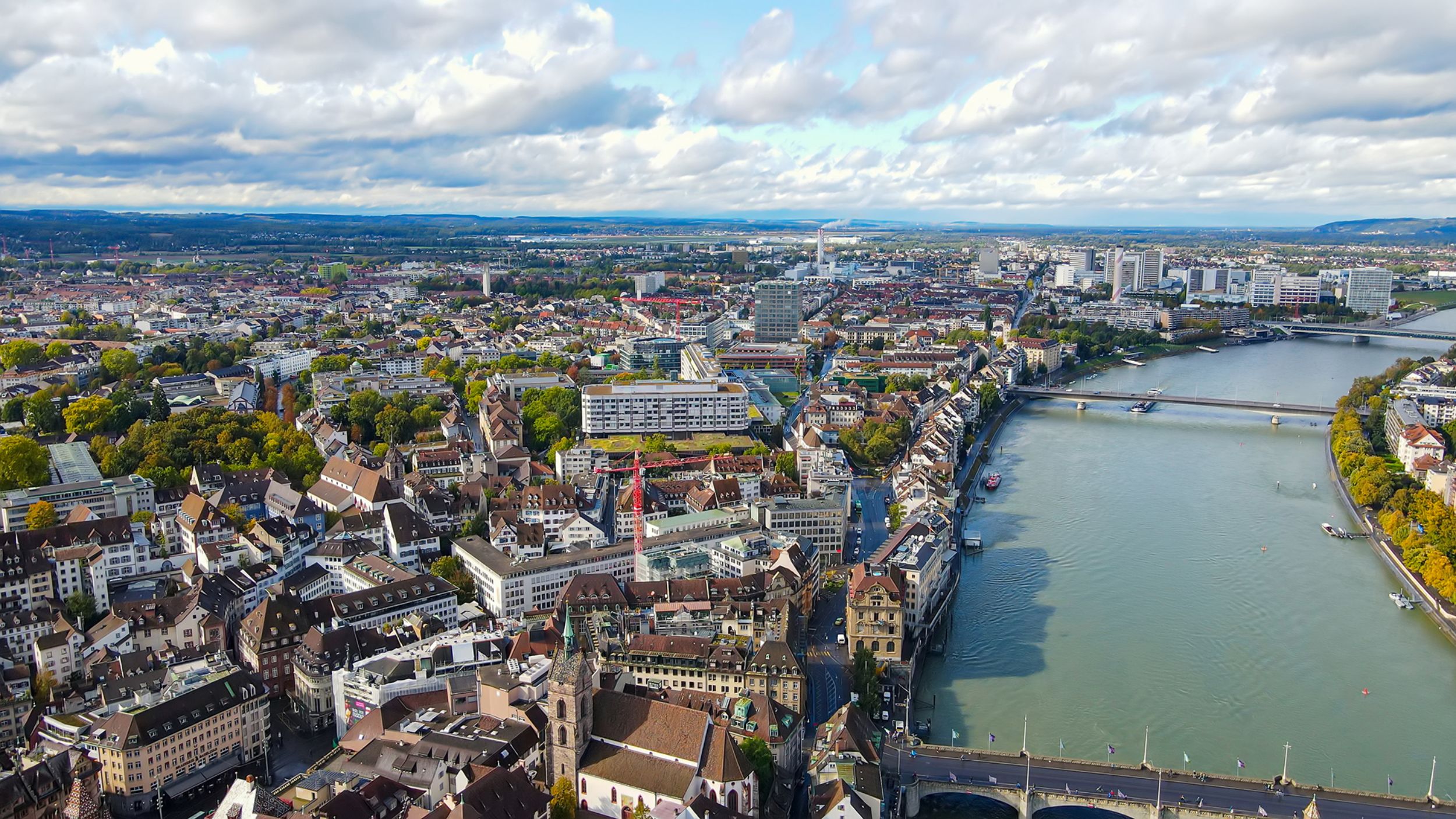 Drone shot of the city of Basel with a view of the Rhine and the USB