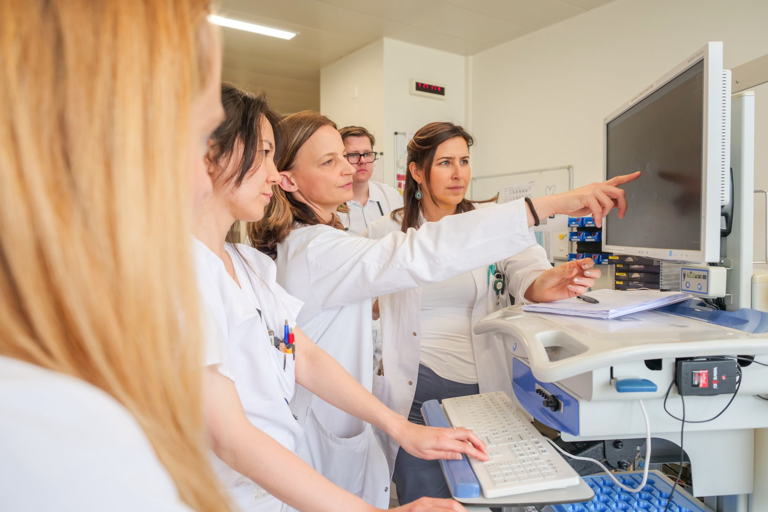 Doctor performs neurovascular ultrasound on patient