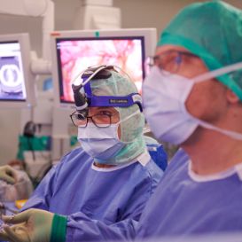 Prof. Didier Lardinois and Dr. Aljaz Hojski during a minimally invasive procedure in the operating room.